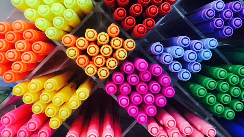 Assorted colorful markers inside of a store.