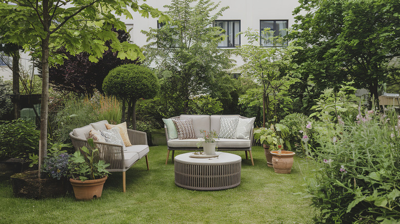 View of backyard garden and patio furniture
