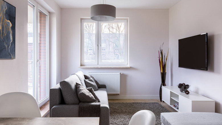 A living room space with a small window