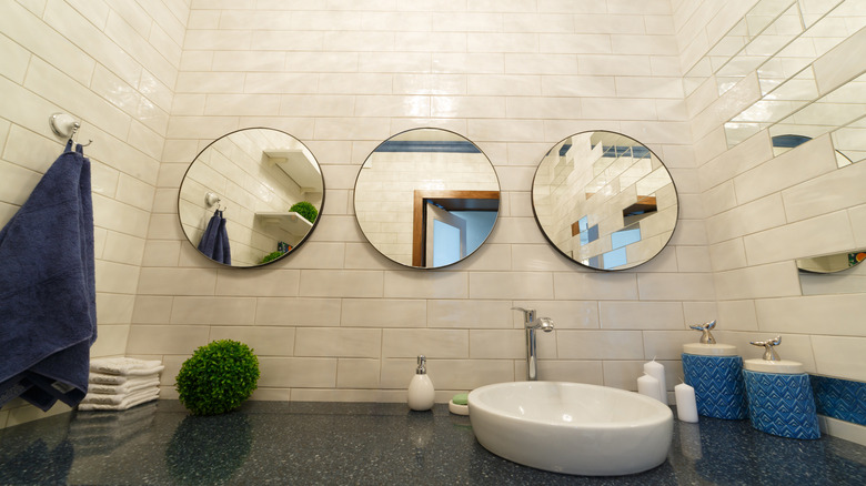 Multiple hanging bathroom mirrors