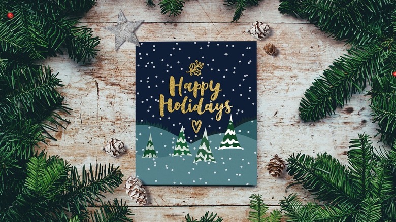 Happy Holidays card on table