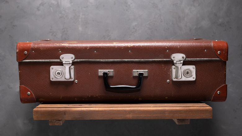 vintage suitcase on floating shelf