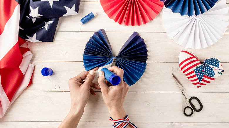 Hands DIYing 4th of July decor