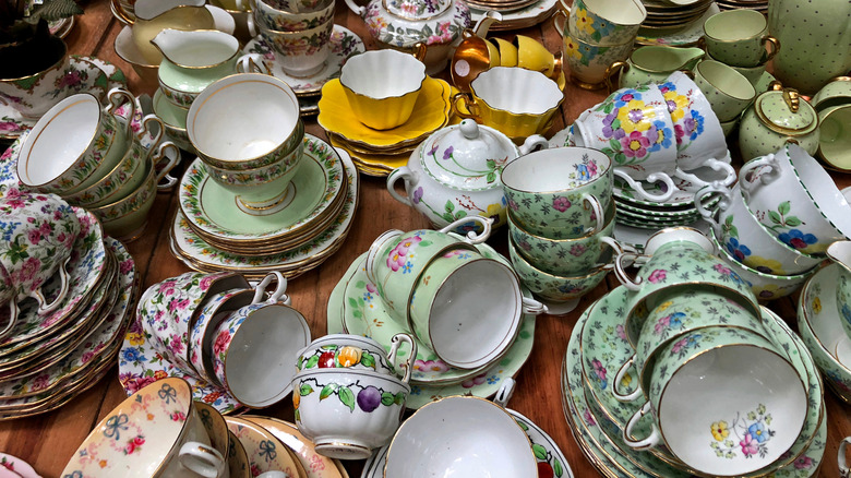 A collection of colorful vintage teacups and saucers