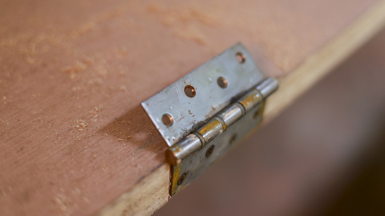 hinge half attached to some wood