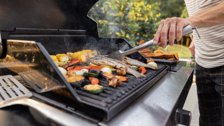 Person cooking on a barbecue