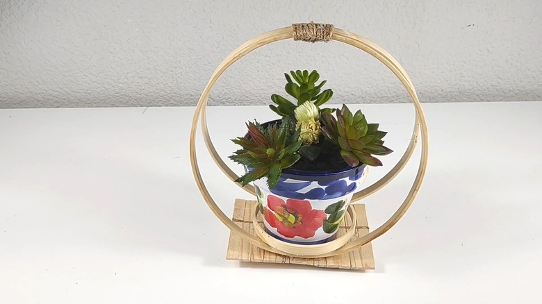 Embroidery hoop plant stand for potted plants