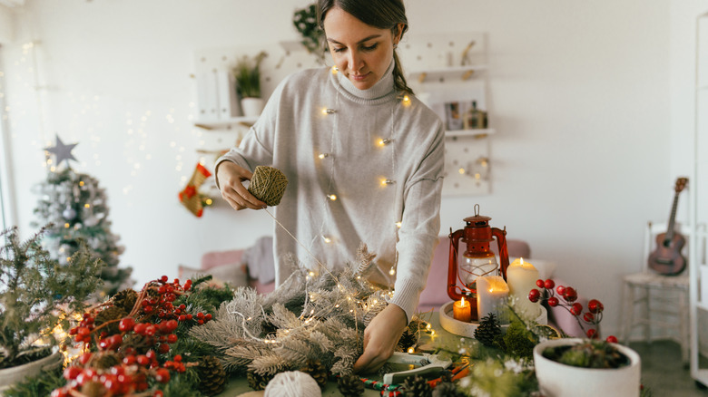 woman making Christmas decorations