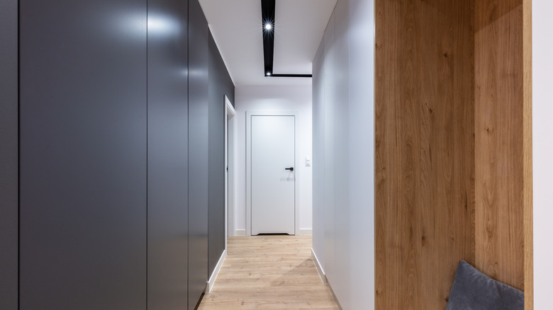 Hallway with wood wall