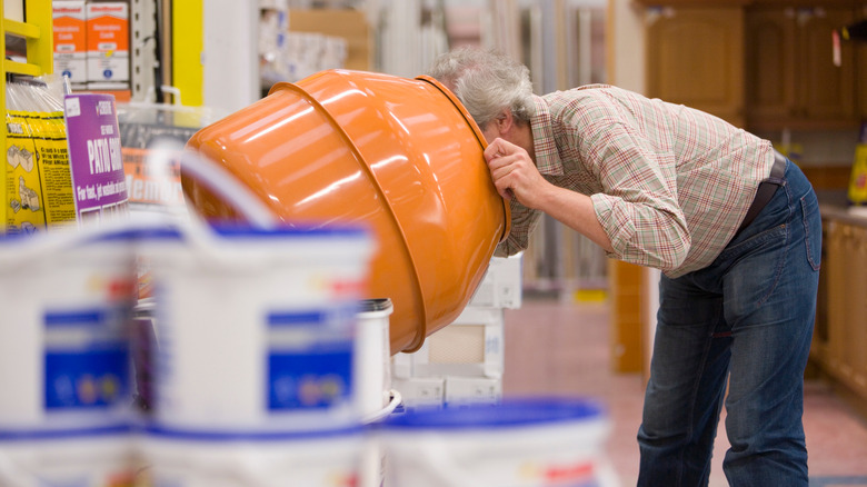 Shopper looks inside cement mixer