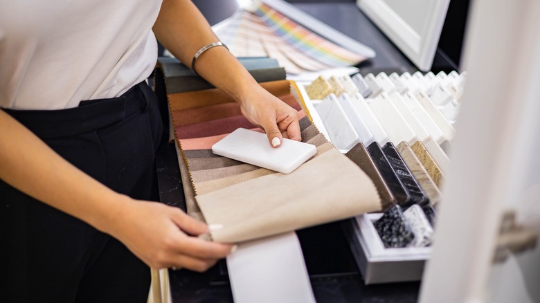 person checking color samples