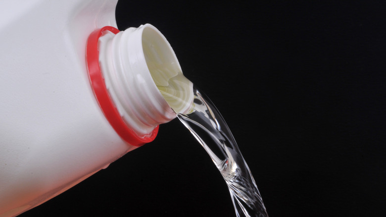 Bleach pouring from a jug