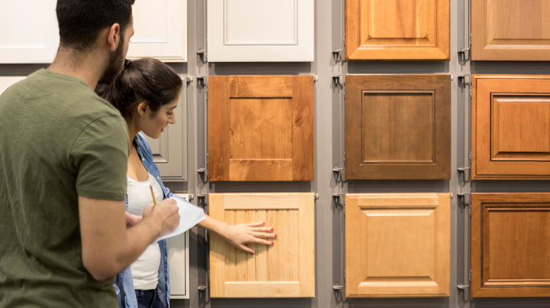 Couple shopping for cabinets