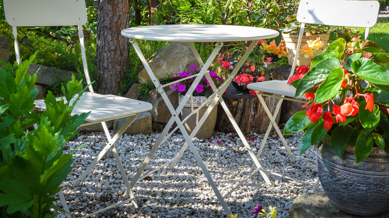 two chairs and a table in garden