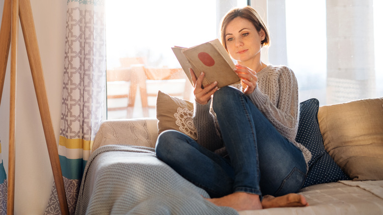 Person reading on a couch