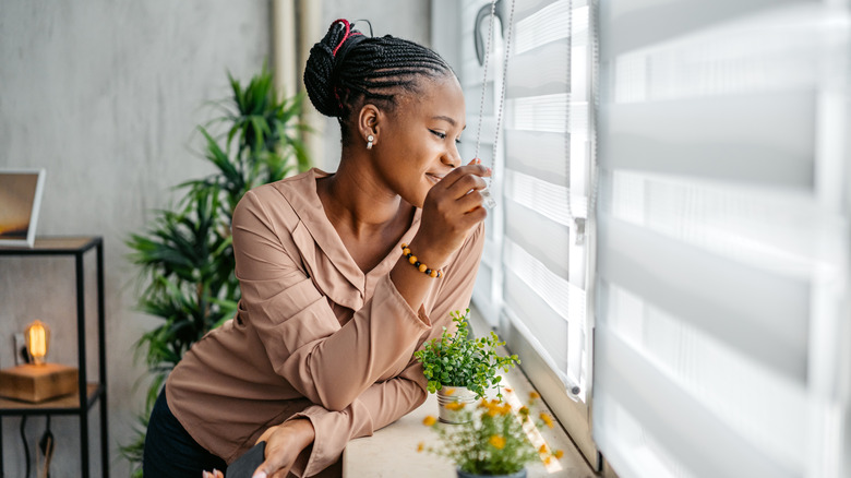 Woman staring out window