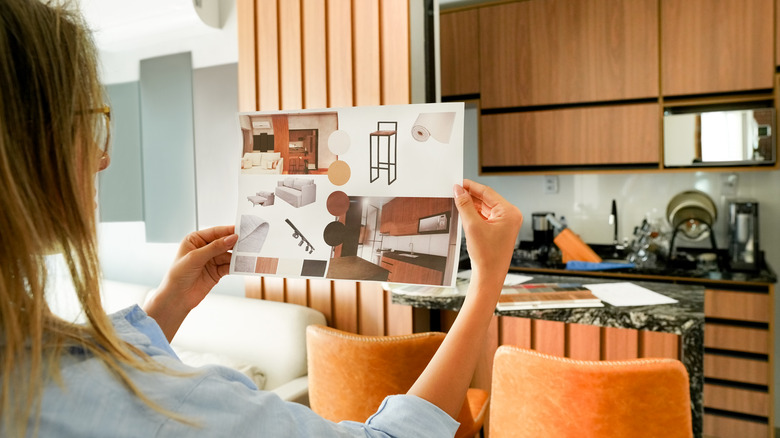 woman considering new colors for her kitchen