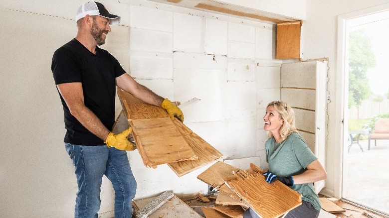 Dave and Jenny Marrs holding pieces of wood
