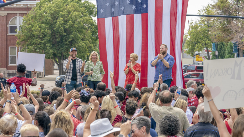 "Home Town Takeover" cast on stage in front of crowd