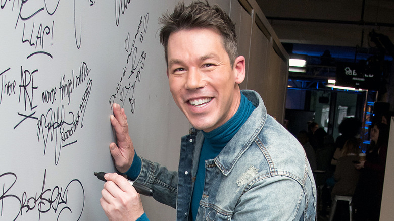 David Bromstad signing wall for a premiere