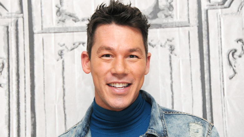 David Bromstad smiles at an event