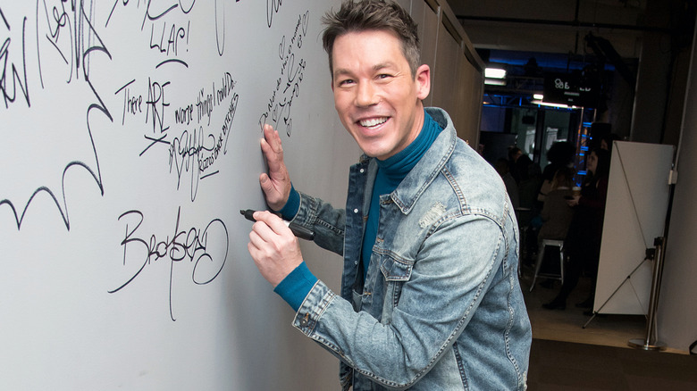 David Bromstad signing wall for a premiere