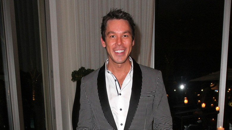 David Bromstad in a checkered suit jacket.