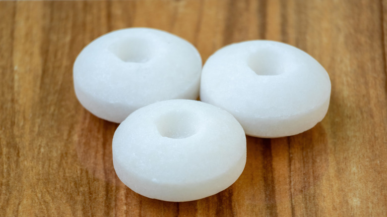 Three mothballs on a table