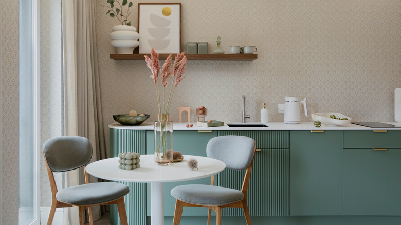 Kitchen with blue-green cabinetry