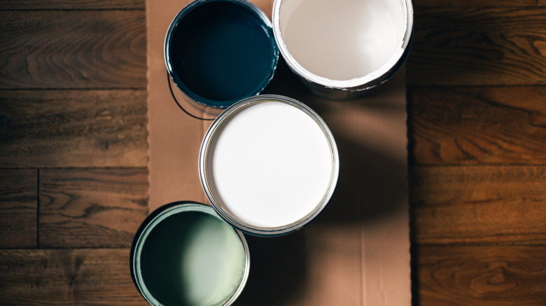 Cans of blue and green paint