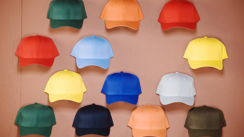 Baseball hats attached to wall