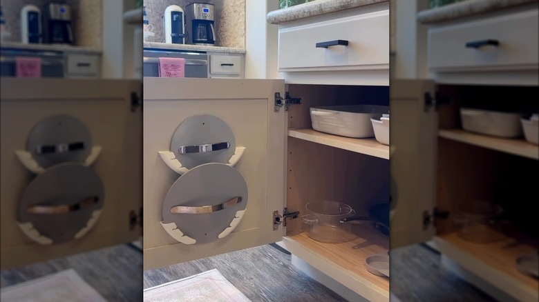 Plastic pot lid holders in action within a cabinet.