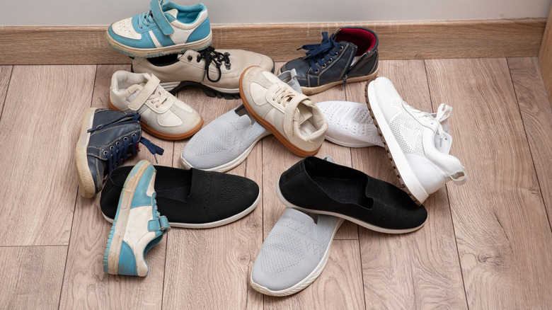 Pile of shoes and sneakers in entryway