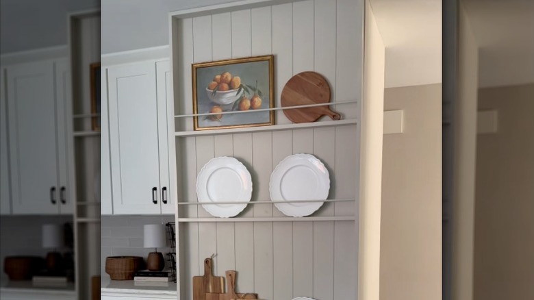 A plate rack wall in a kitchen.