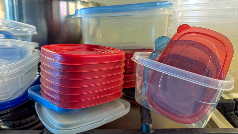 Stacks of plastic storage containers with their lids