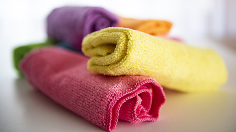 A stack of multicolored microfiber cleaning cloths