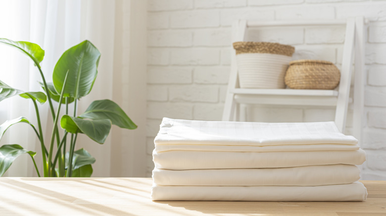 A stack of white folded sheets