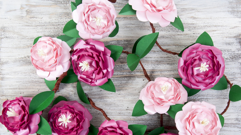 A garland made from pink and purple paper flowers