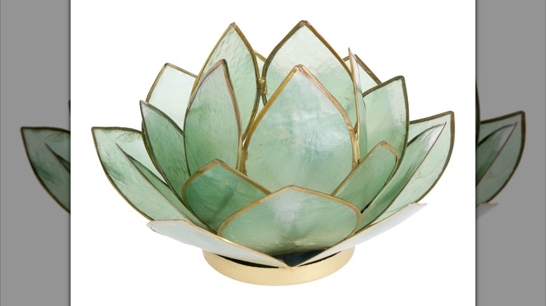 A green-colored lotus flower tea light holder