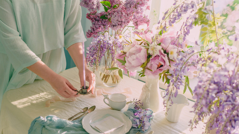 A person setting a festive spring table
