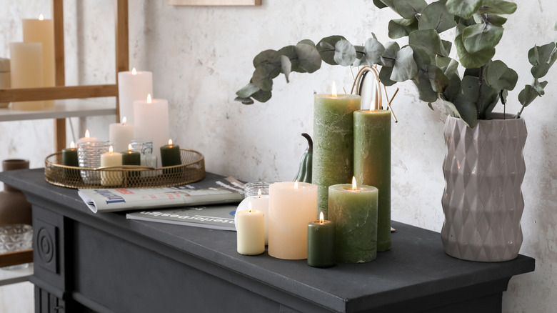 A decorated mantel with greenery