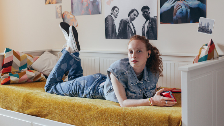 Girl in retro inspired bedroom