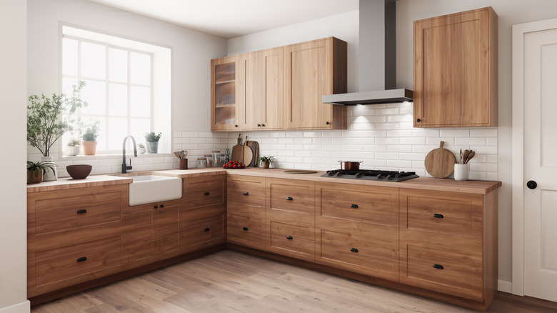 modern kitchen with natural wood cabinets