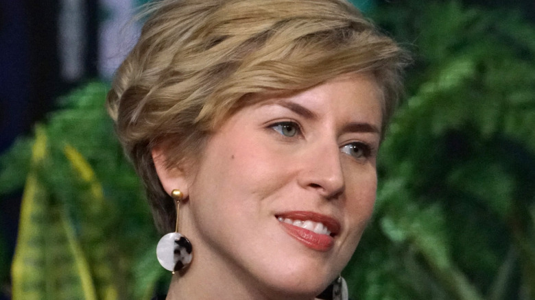 Erin Napier smiling and looking to the side