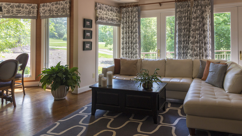 Room with beige sectional sofa