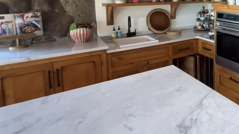 Engineer marble countertops on kitchen island and workspaces
