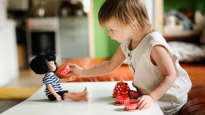 Child playing at coffee table