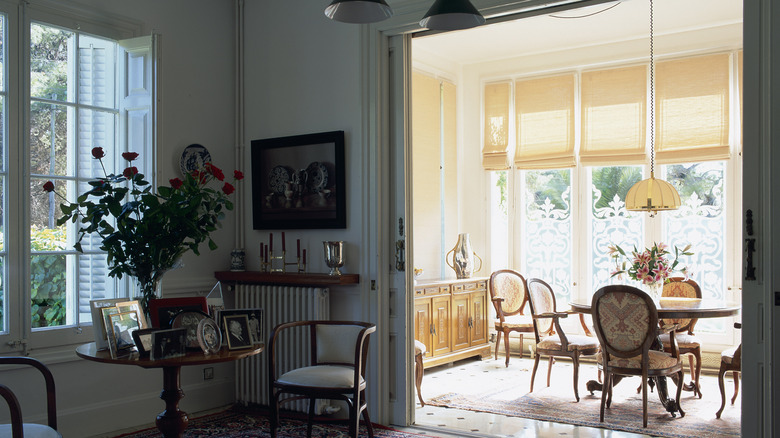 A room with blue-gray walls and the same blue-gray trim