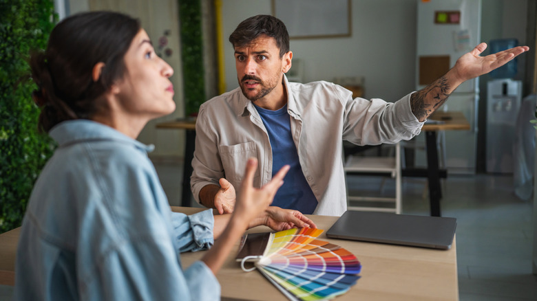 Two designers arguing about paint colors