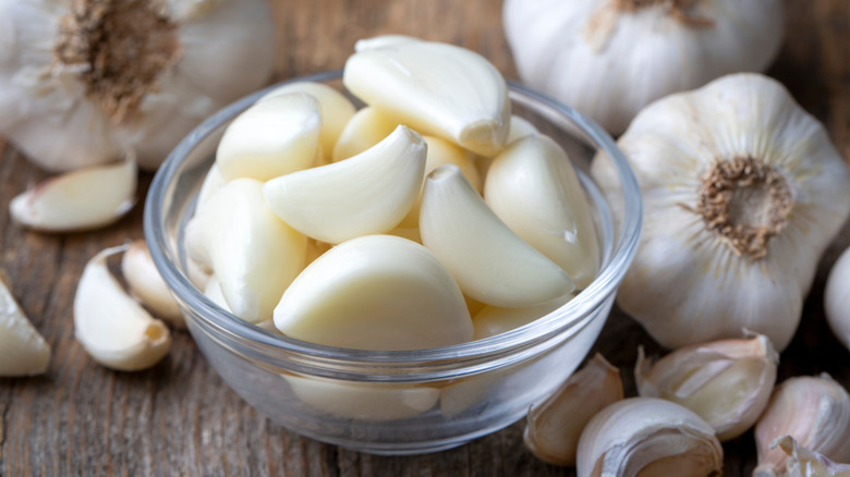 Peeled garlic cloves in a small bowl